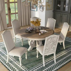 Caelum 7-Piece Round Dining Set with White Fabric Upholstery by The Gray Barn